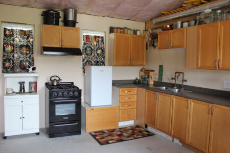 interior of Colette's eco-cabin, showing her compact kitchen.